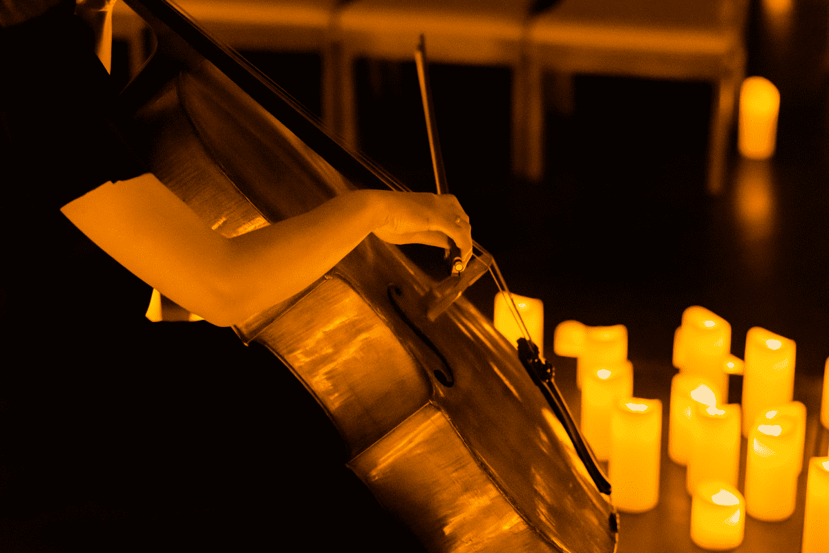 A musician performing by candlelight